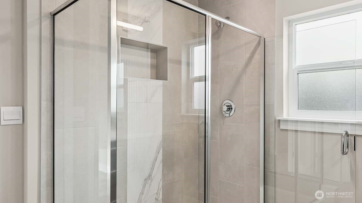 3125 194th Street Southeast Bothell, WA 98012 - Photo 22 of 25 a bathroom with a glass door shower