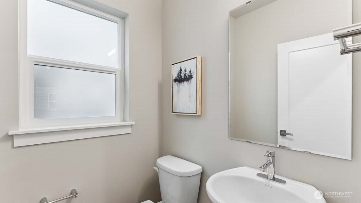 3125 194th Street Southeast Bothell, WA 98012 - Photo 3 of 25 a bathroom with a toilet sink and mirror