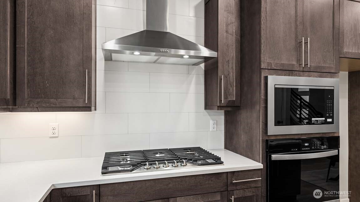 3125 194th Street Southeast Bothell, WA 98012 - Photo 8 of 25 a kitchen with a stove and a refrigerator