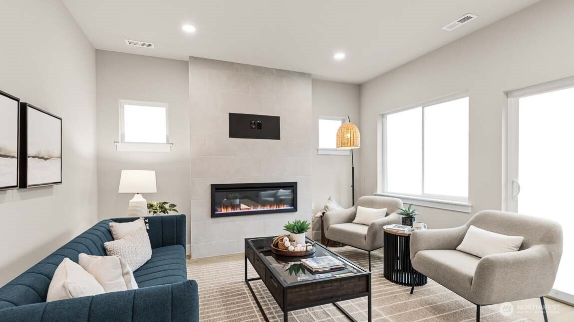 3125 194th Street Southeast Bothell, WA 98012 - Photo 10 of 25 a living room with furniture and a fireplace