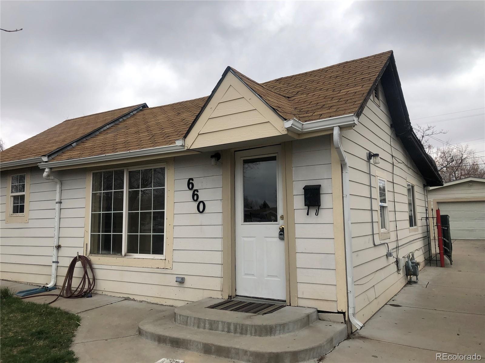 660 South Raleigh Street Denver, CO 80219 - Photo 1 of 21 a view of a white house next to a yard