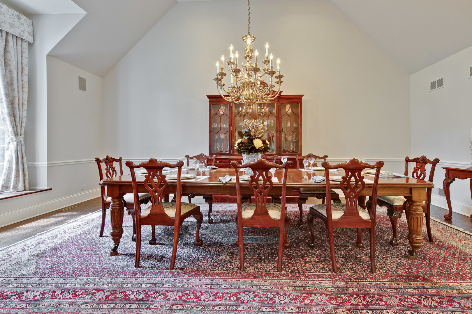 433 South Ridge Road Lake Forest, IL 60045 - Photo 11 of 49 a view of a dining room with furniture a chandelier and wooden floor