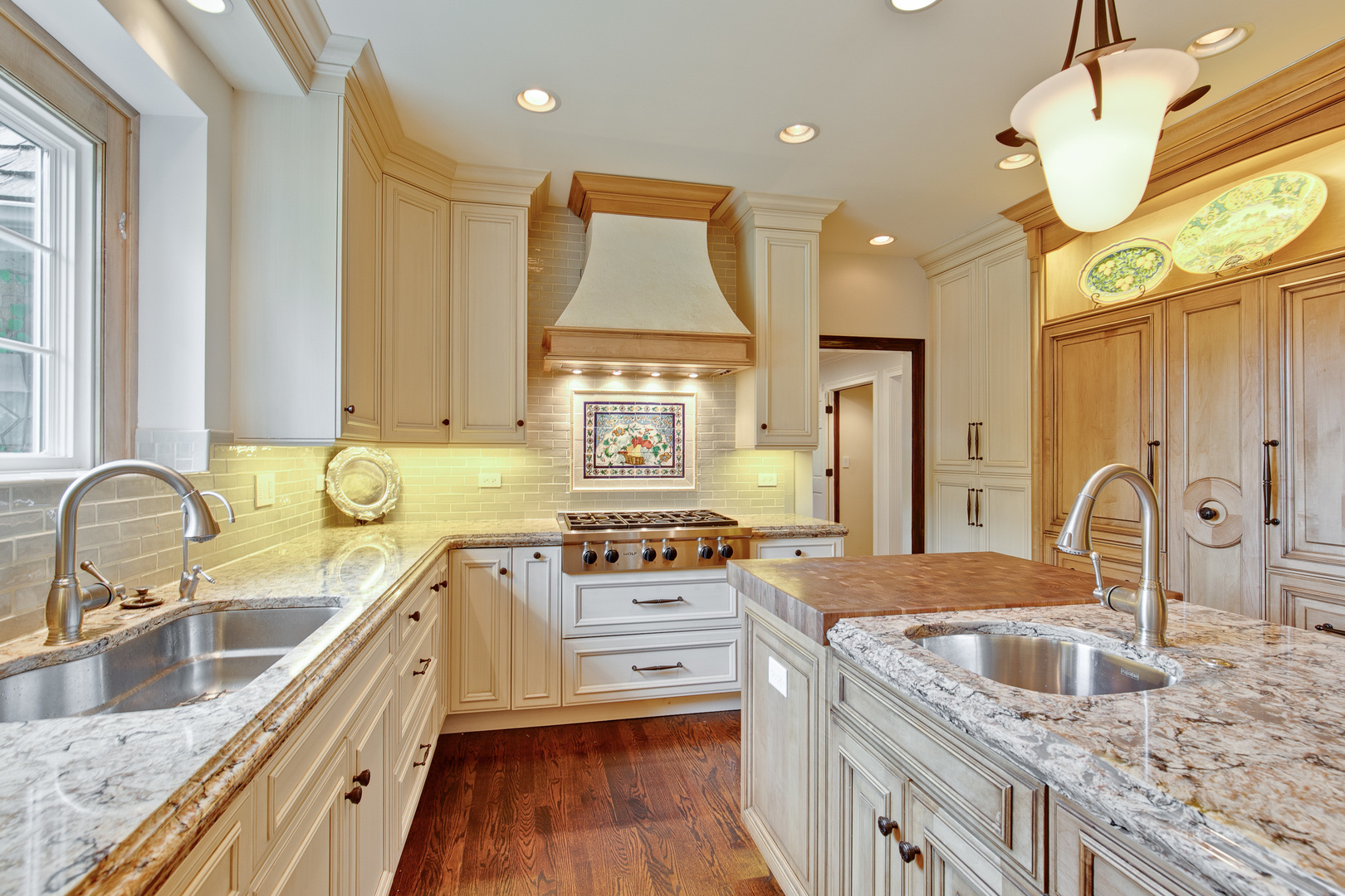 433 South Ridge Road Lake Forest, IL 60045 - Photo 16 of 49 a kitchen with stainless steel appliances granite countertop a sink stove and refrigerator