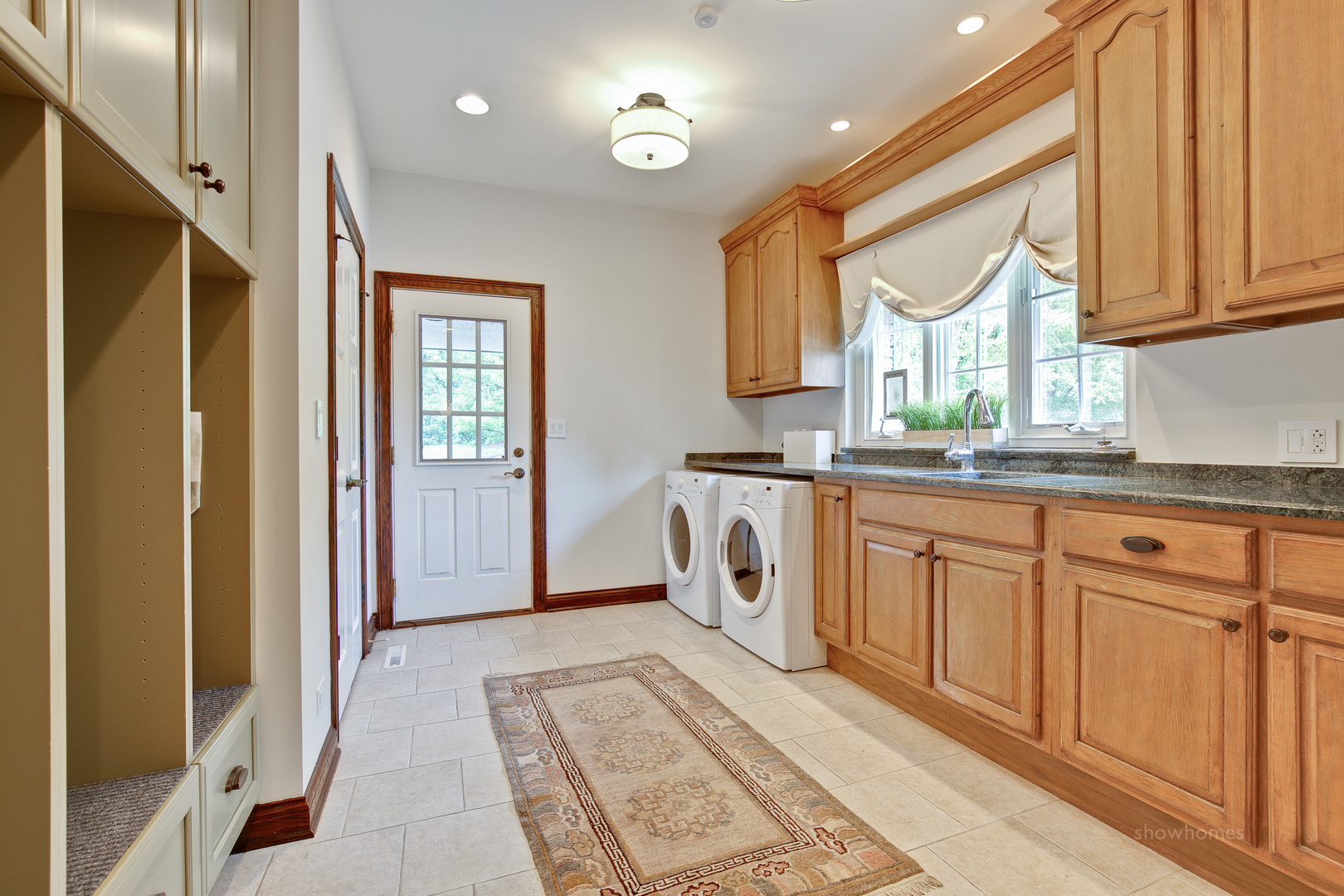 433 South Ridge Road Lake Forest, IL 60045 - Photo 28 of 49 a kitchen with granite countertop a sink cabinets stainless steel appliances and a window