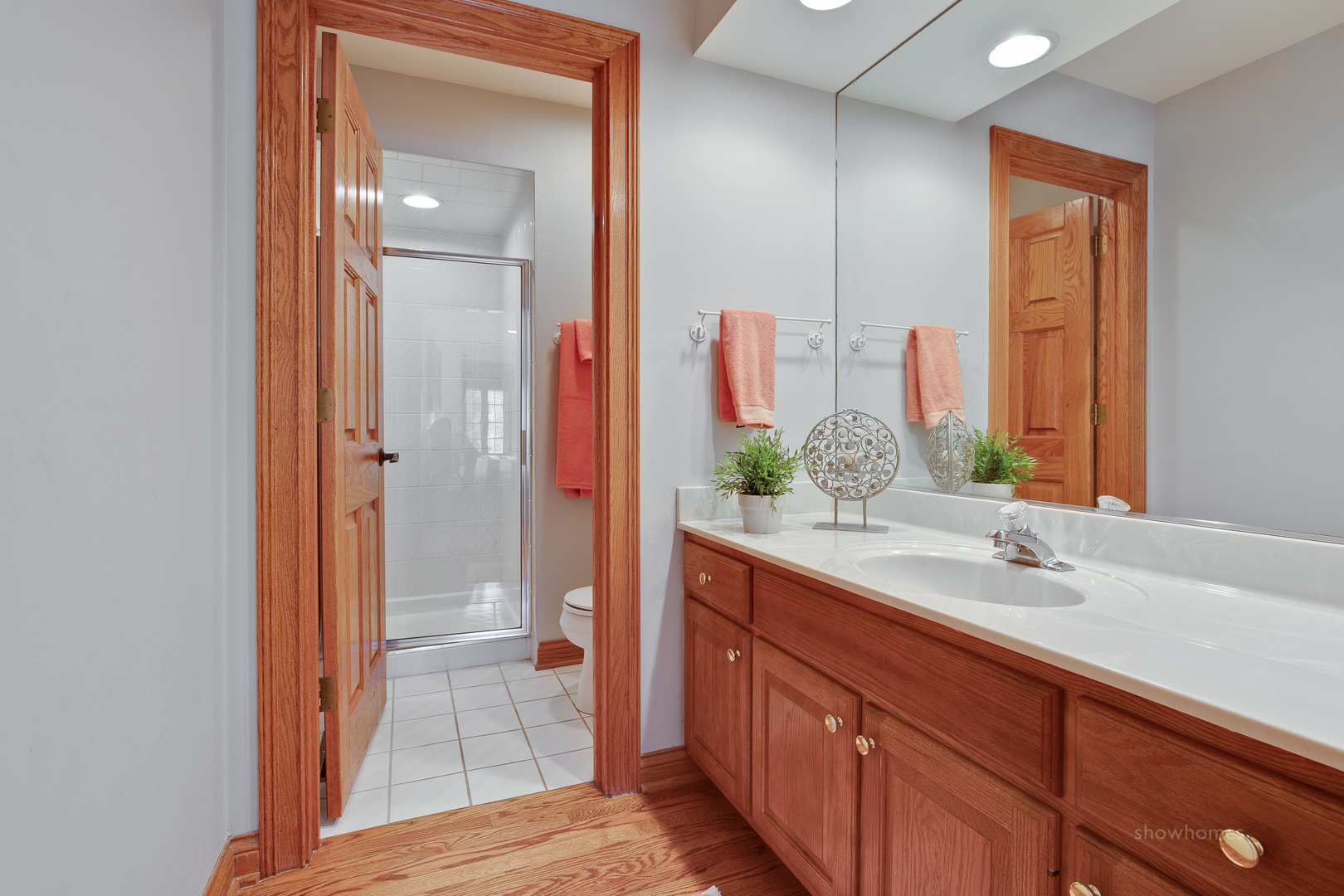 433 South Ridge Road Lake Forest, IL 60045 - Photo 34 of 49 a bathroom with a double vanity sink and mirror