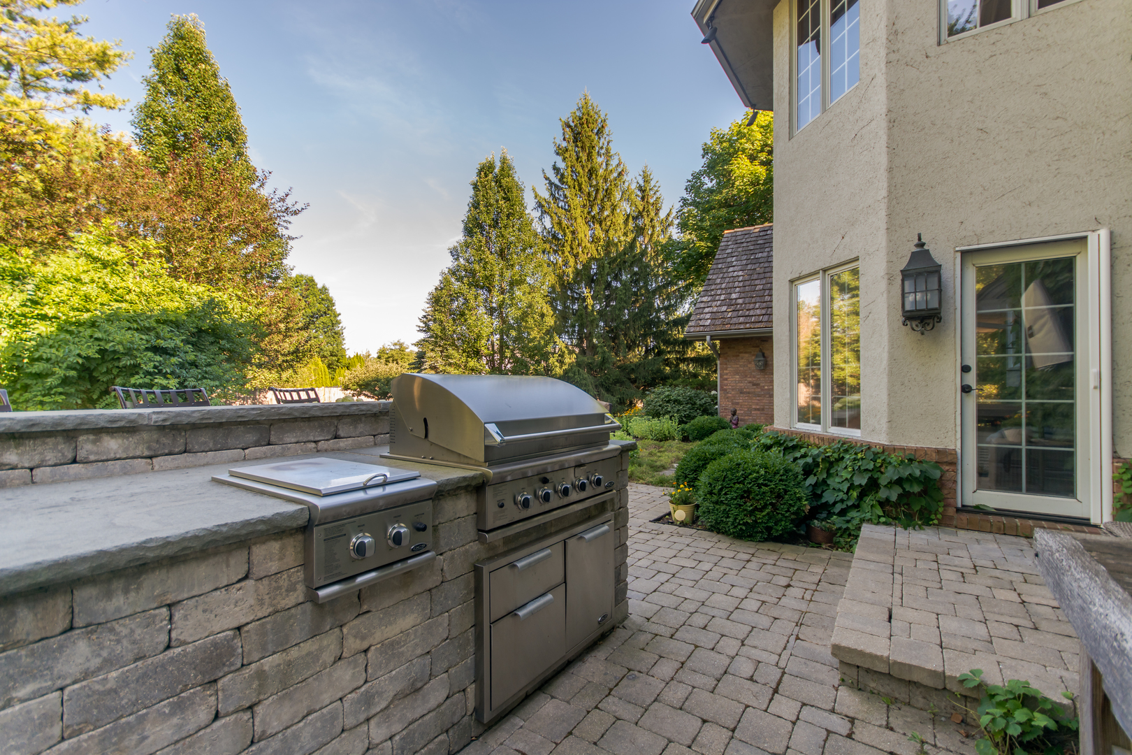 433 South Ridge Road Lake Forest, IL 60045 - Photo 45 of 49 a view of a patio with table and chairs and potted plants