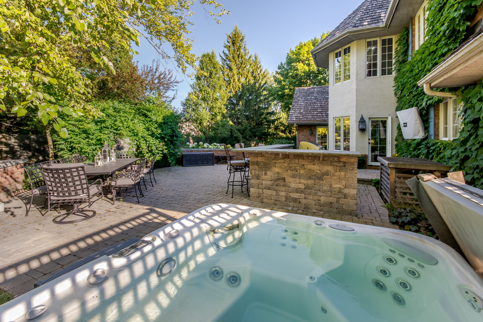 433 South Ridge Road Lake Forest, IL 60045 - Photo 46 of 49 a view of a patio with table and chairs potted plants and large tree