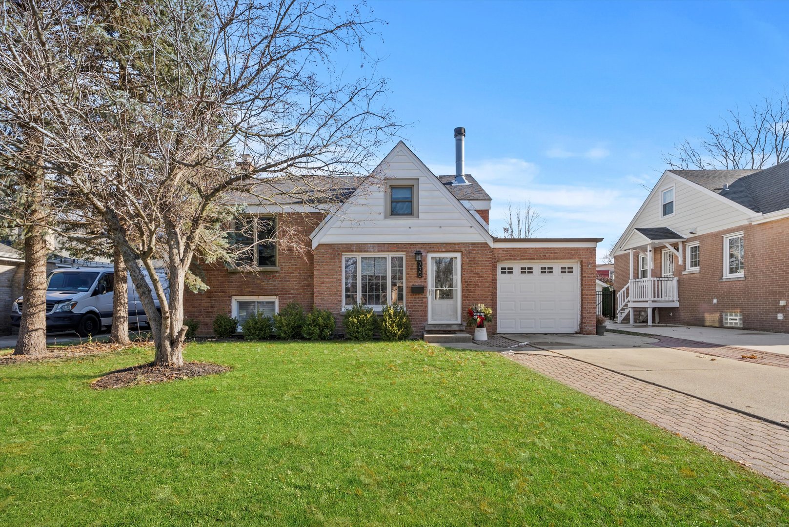 735 Forest Road La Grange Park, IL 60526 - Photo 2 of 31 a front view of a house with a yard and trees
