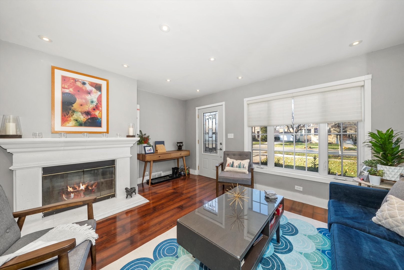 735 Forest Road La Grange Park, IL 60526 - Photo 5 of 31 a living room with furniture a fireplace and a table