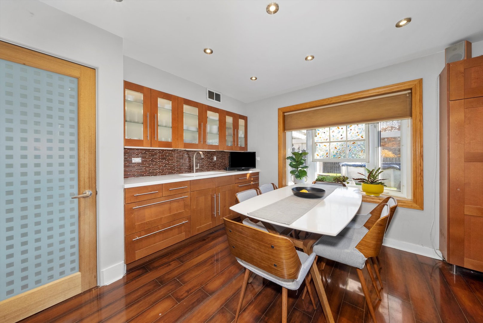 735 Forest Road La Grange Park, IL 60526 - Photo 10 of 31 a kitchen with a table chairs and wooden floor
