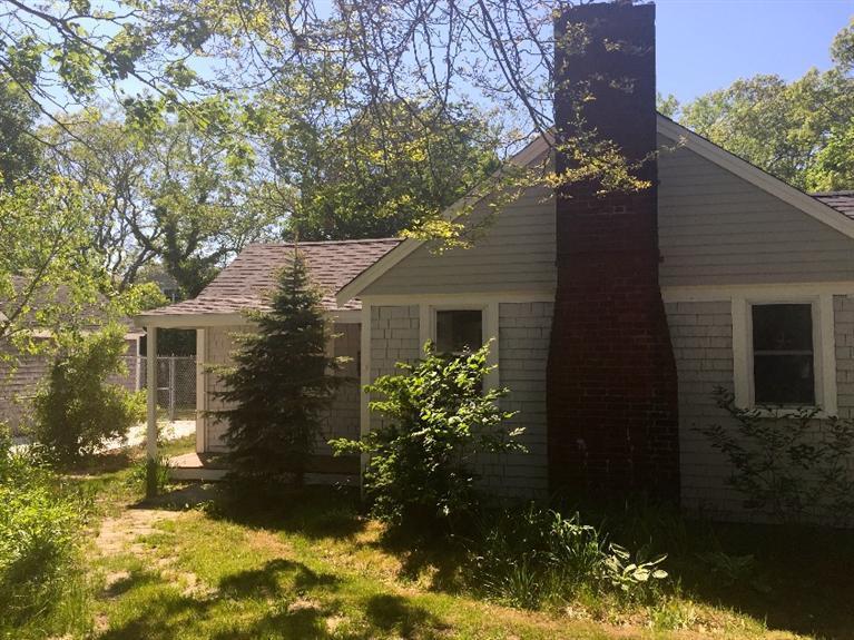 129 Spring Street Hyannis, MA 02601 - Photo 1 of 31 a view of a house with a yard