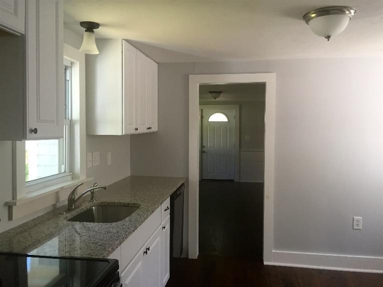 129 Spring Street Hyannis, MA 02601 - Photo 13 of 31 a kitchen with a sink and cabinets