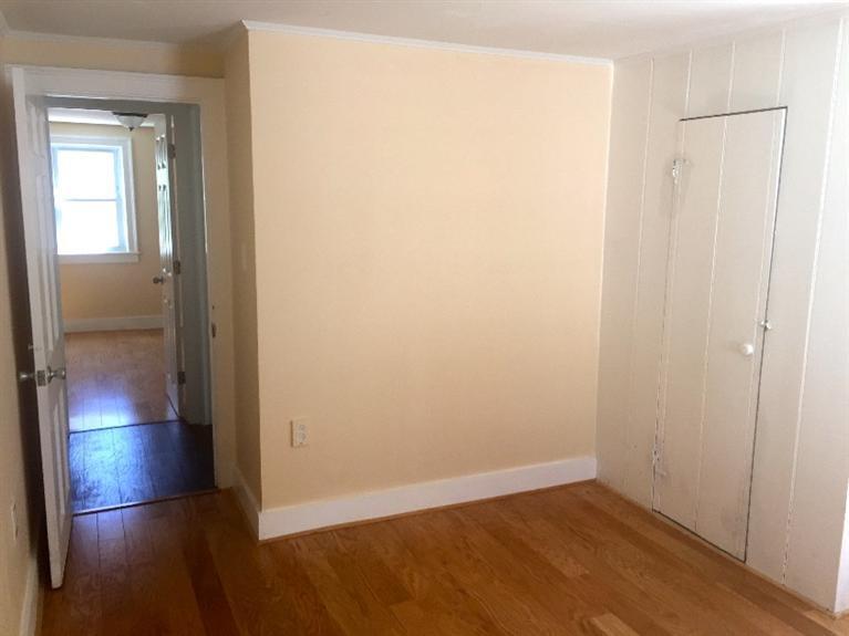 129 Spring Street Hyannis, MA 02601 - Photo 16 of 31 an empty room with wooden floor and closet