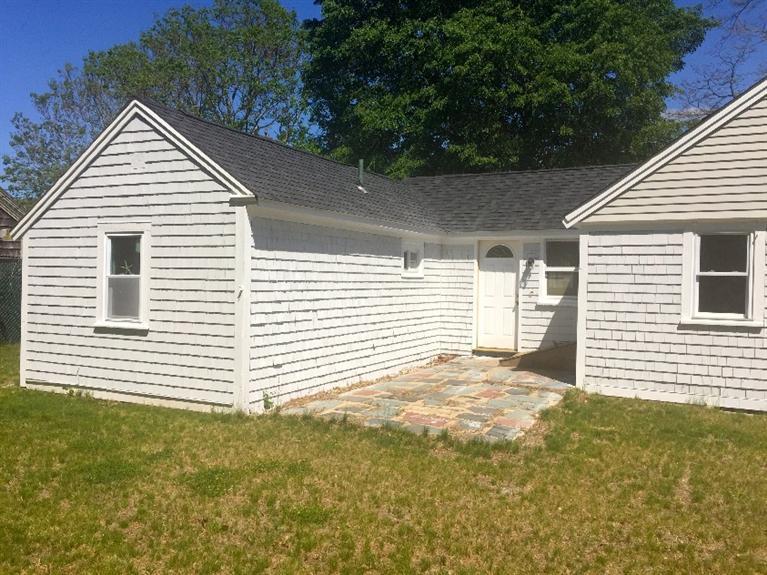 129 Spring Street Hyannis, MA 02601 - Photo 23 of 31 a view of a backyard with a garden