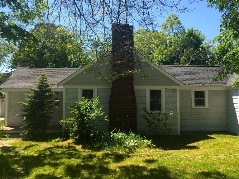 129 Spring Street Hyannis, MA 02601 - Photo 28 of 31 a view of a house with a yard