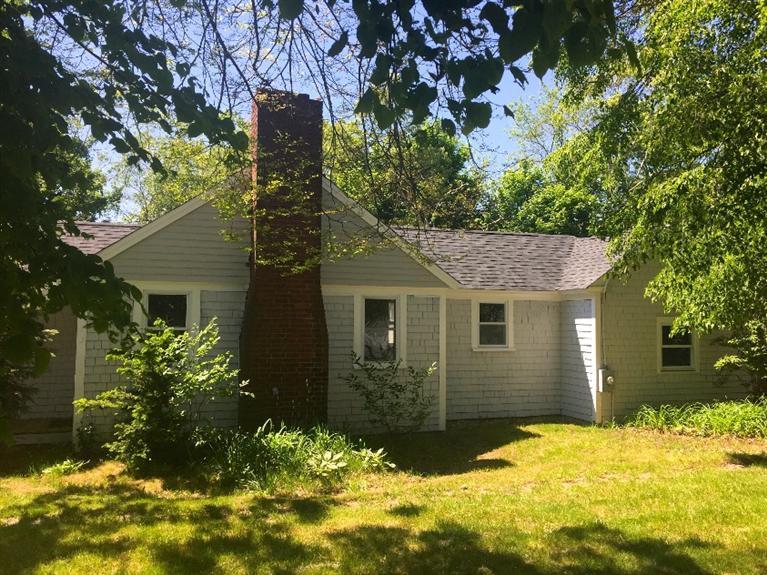129 Spring Street Hyannis, MA 02601 - Photo 3 of 31 a view of a house with a yard