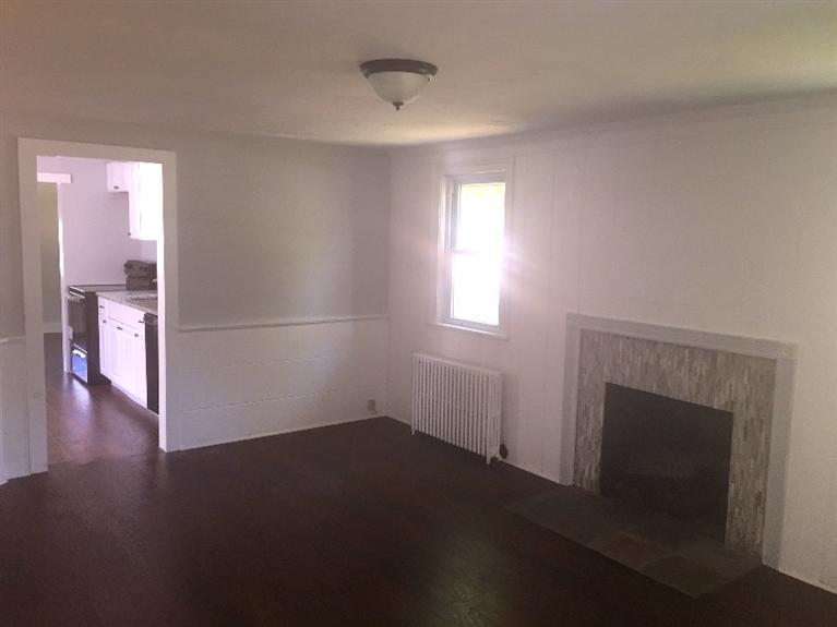 129 Spring Street Hyannis, MA 02601 - Photo 5 of 31 a view of empty room with wooden floor and fan