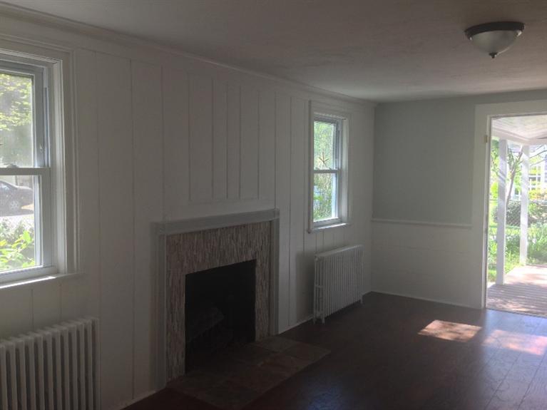 129 Spring Street Hyannis, MA 02601 - Photo 7 of 31 a view of empty room with wooden floor and fan