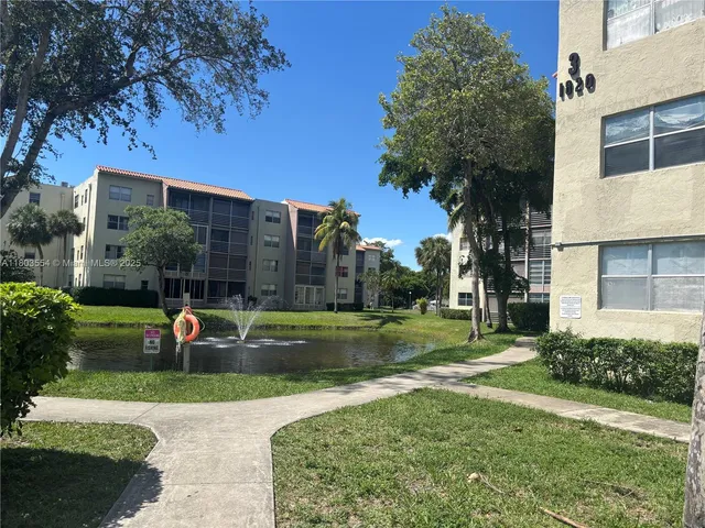 a view of a park with large trees