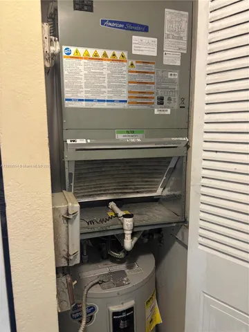a stove top oven sitting inside of a kitchen