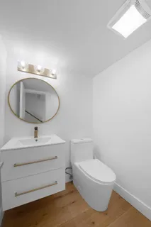 a room with a sink and cabinets
