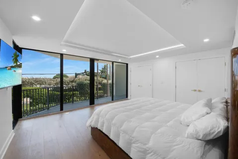 a bathroom with a sink mirror vanity and toilet