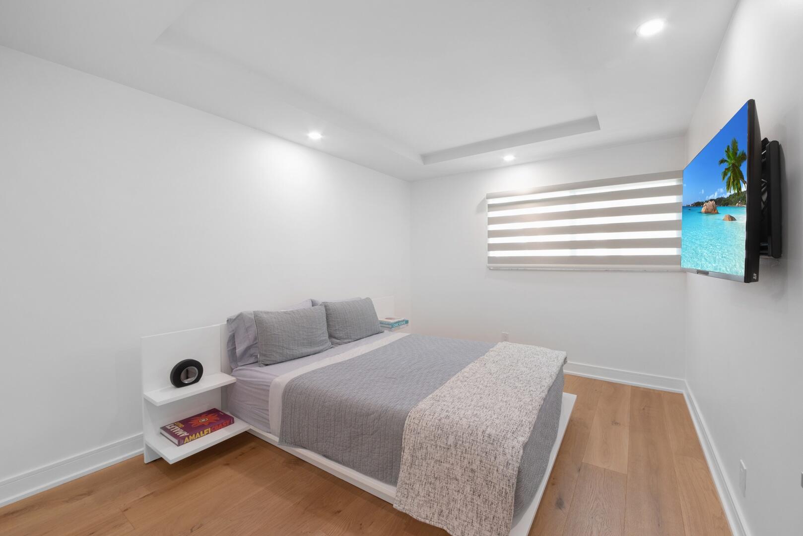 800 North Ocean Boulevard, Unit 4 Delray Beach, FL 33483 - Photo 20 of 30 a bedroom with a bed and a window