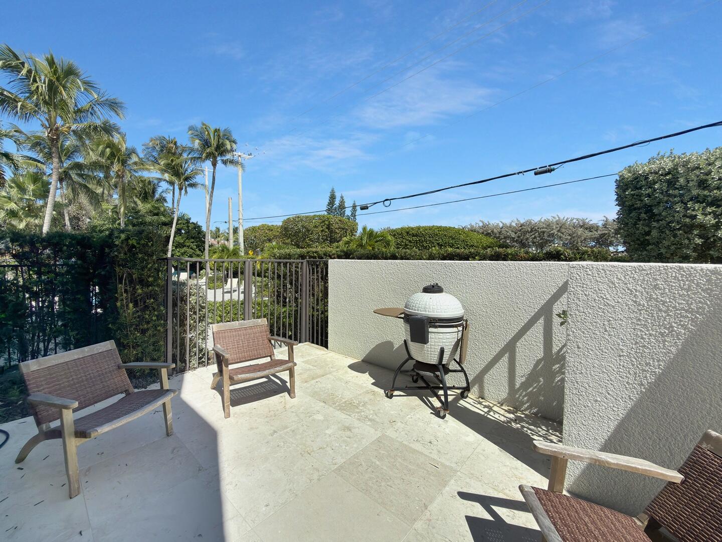 800 North Ocean Boulevard, Unit 4 Delray Beach, FL 33483 - Photo 24 of 30 a view of a chairs and table in patio
