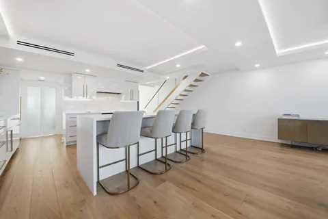 a view of a livingroom with furniture and wooden floor