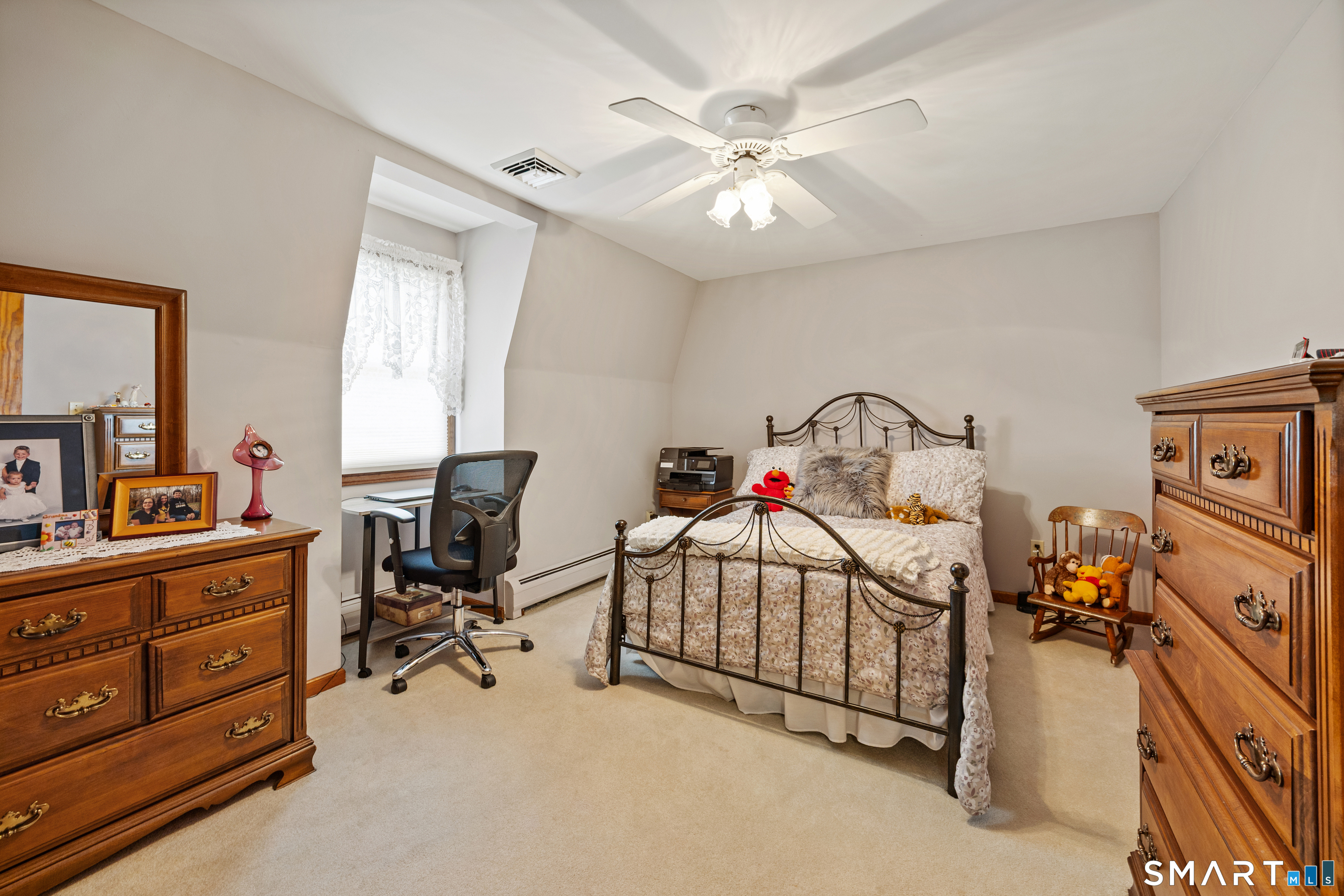 42 Chimney Sweep Road Wallingford, CT 06492 - Photo 27 of 40 a bedroom with a bed and a chandelier