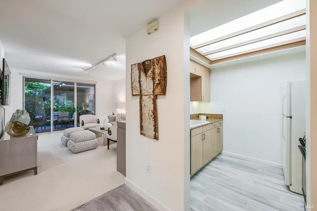 a bathroom with a tub sink and mirror