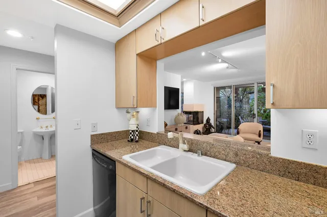 a view of living room with granite countertop furniture and fireplace