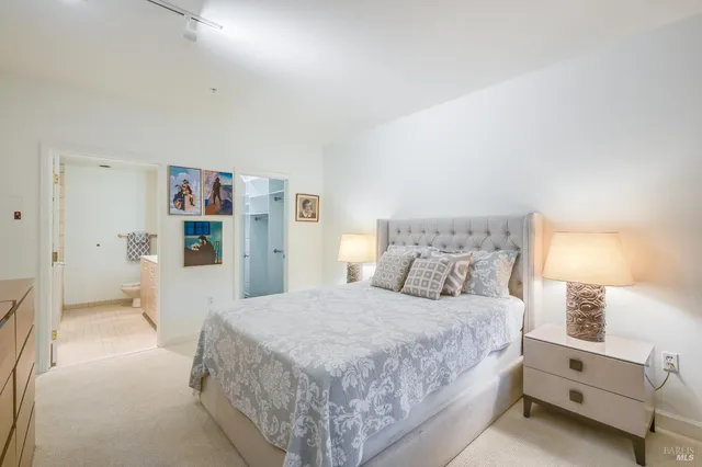 a bedroom with a bed and a cabinets