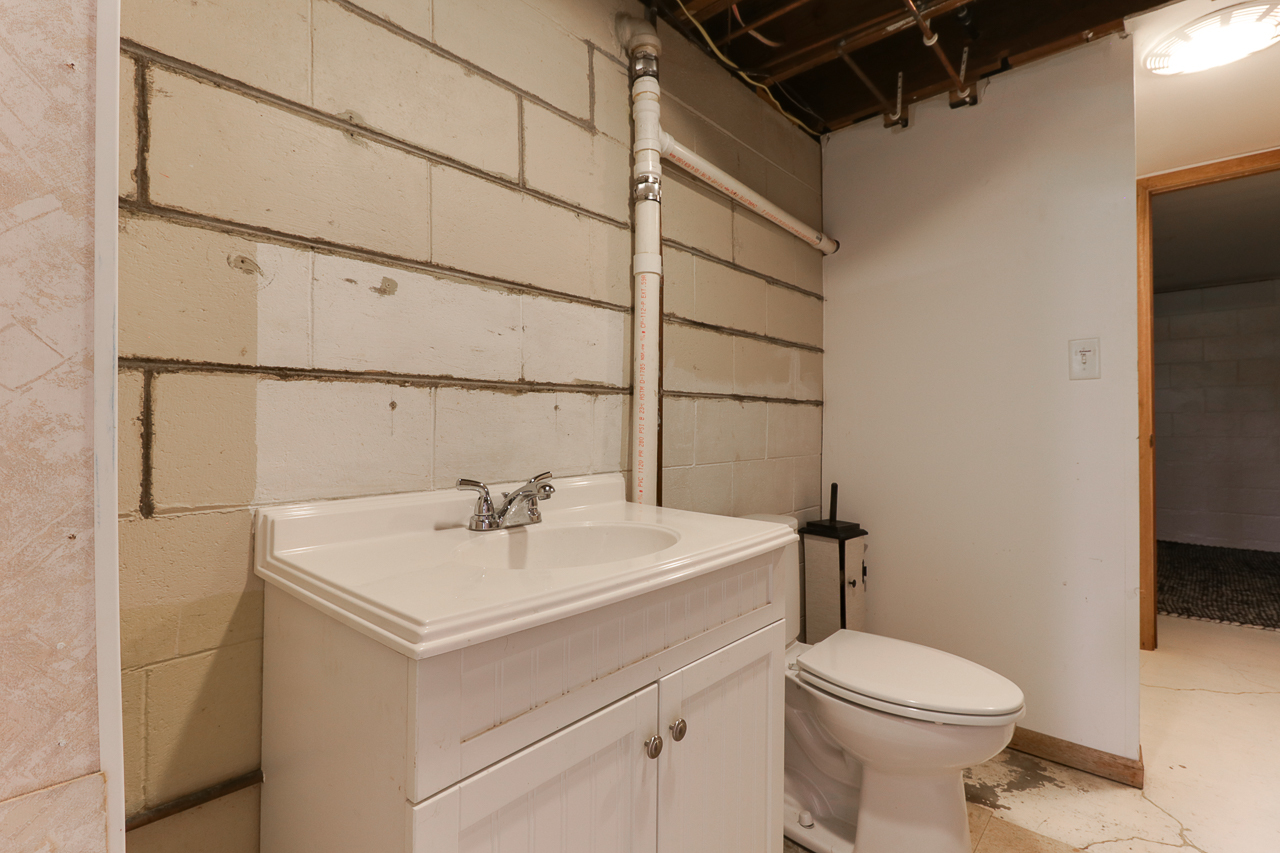24 Ardith Drive Normal, IL 61761 - Photo 22 of 30 a bathroom with a sink toilet and mirror