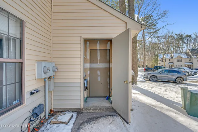 a view of a livingroom with storage and utility