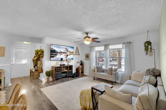 a kitchen with stainless steel appliances granite countertop a sink and a refrigerator