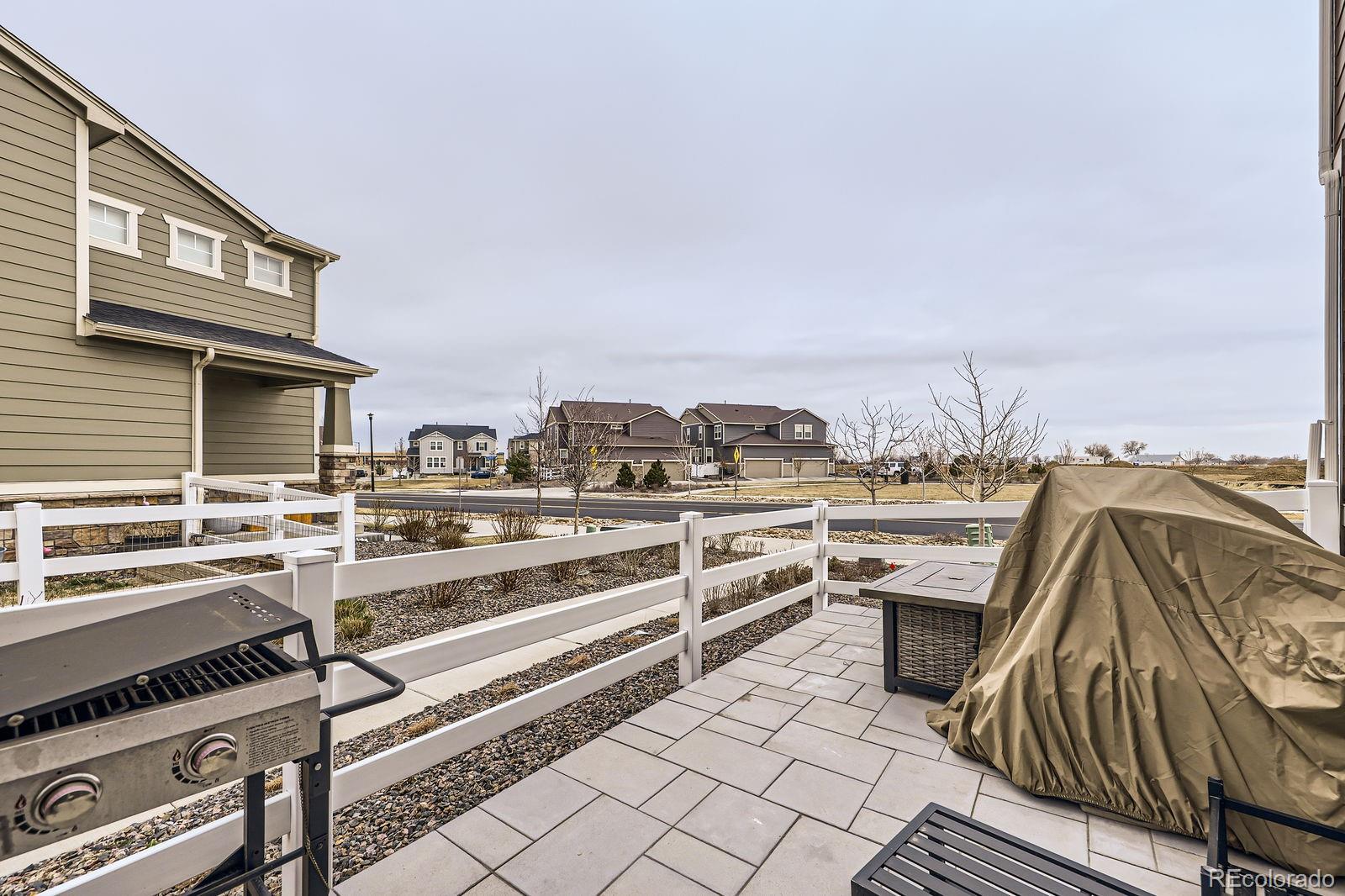 5142 Bittercress Road Brighton, CO 80640 - Photo 11 of 11 a view of a chairs and table on the terrace