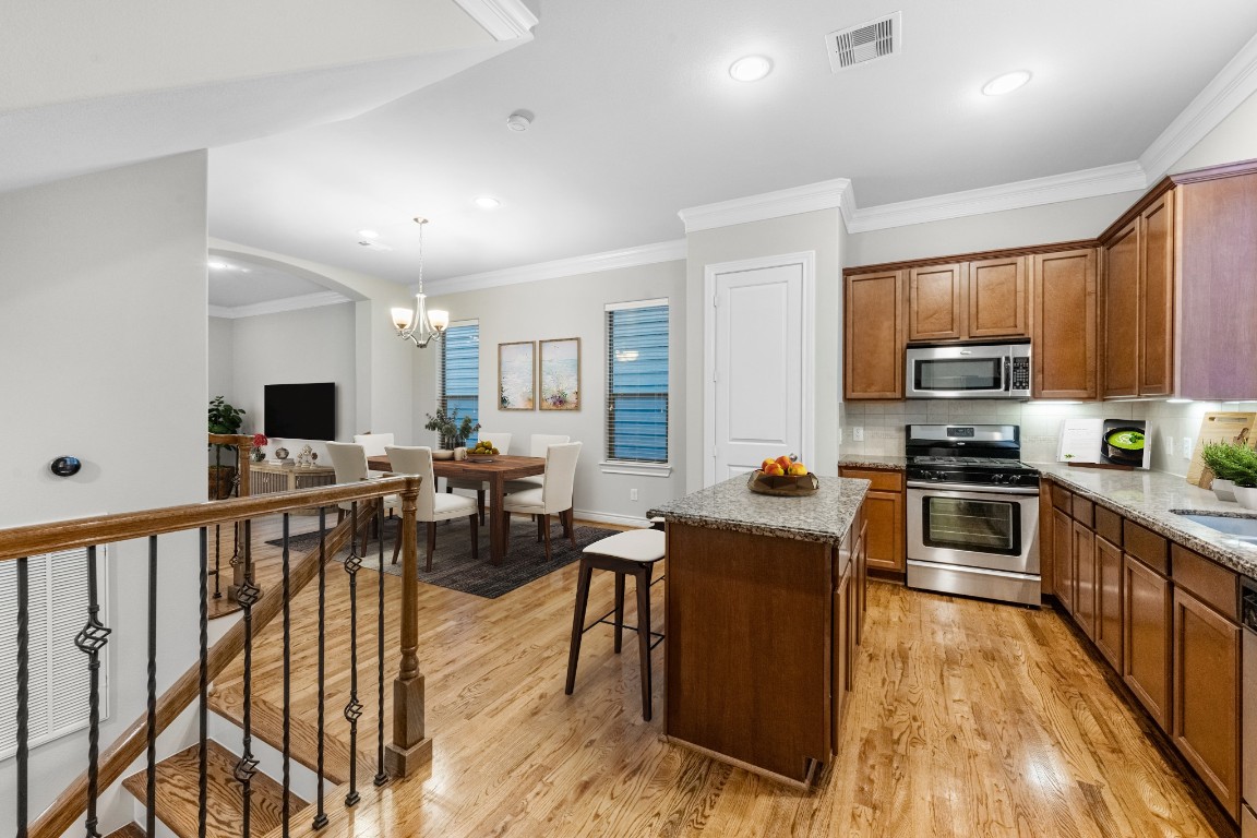 3414 Center Street Houston, TX 77007 - Photo 16 of 35 a kitchen with counter top space a sink and appliances