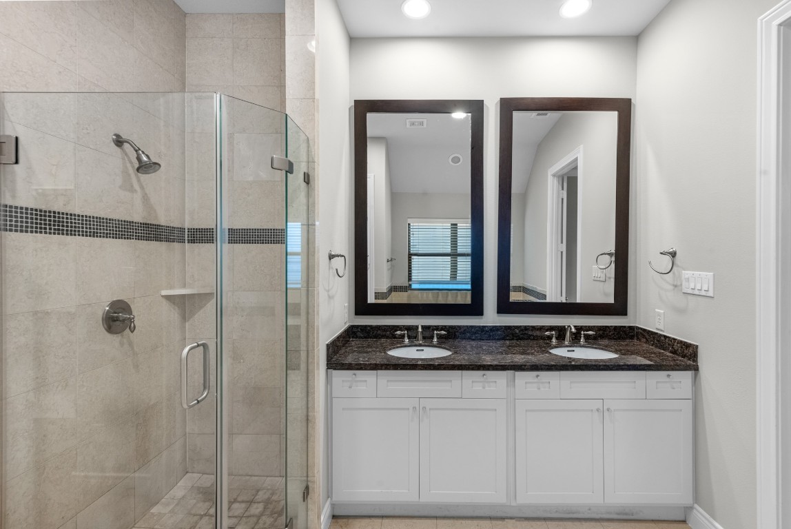 3414 Center Street Houston, TX 77007 - Photo 25 of 35 a bathroom with a granite countertop sink and a mirror