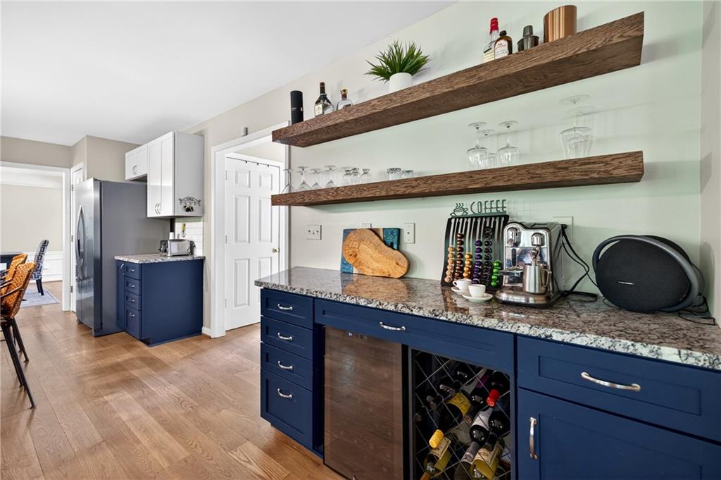 7830 Llangollen Way Cumming, GA 30041 - Photo 12 of 60 a kitchen with granite countertop a stove and cabinets