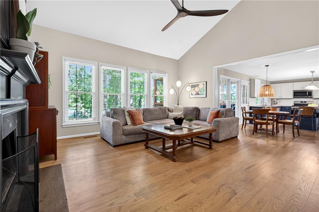 7830 Llangollen Way Cumming, GA 30041 - Photo 15 of 60 a living room with furniture and a fireplace