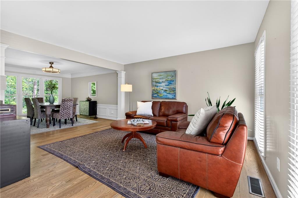 7830 Llangollen Way Cumming, GA 30041 - Photo 16 of 60 a living room with furniture and wooden floor