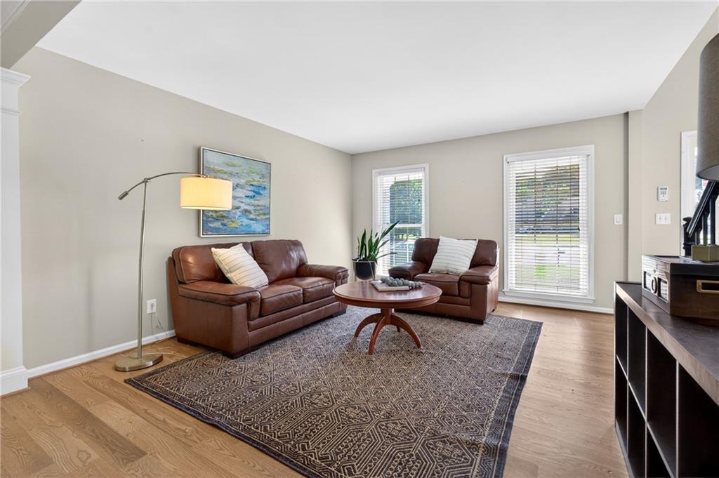 7830 Llangollen Way Cumming, GA 30041 - Photo 17 of 60 a living room with furniture and a flat screen tv