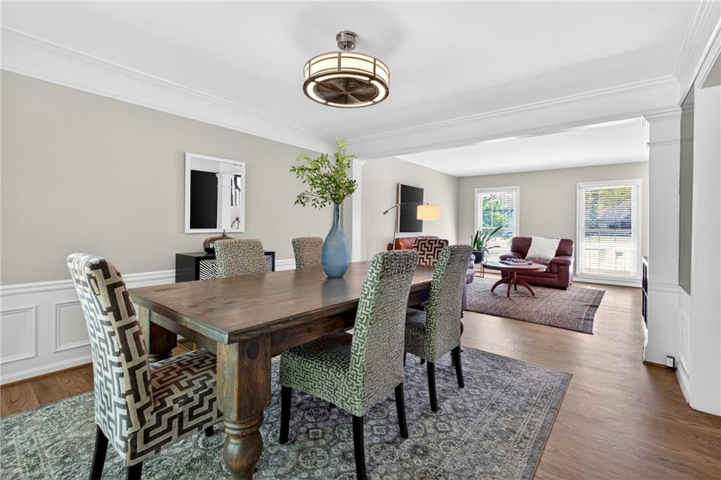 7830 Llangollen Way Cumming, GA 30041 - Photo 19 of 60 a view of a dining room with furniture and wooden floor