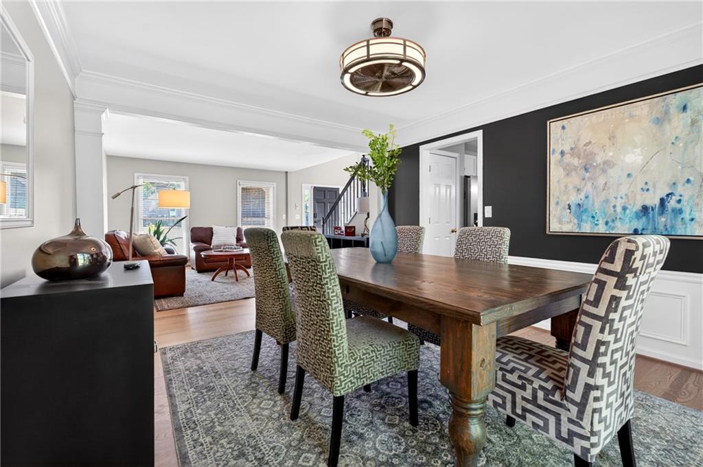 7830 Llangollen Way Cumming, GA 30041 - Photo 20 of 60 a view of a dining room with furniture and chandelier