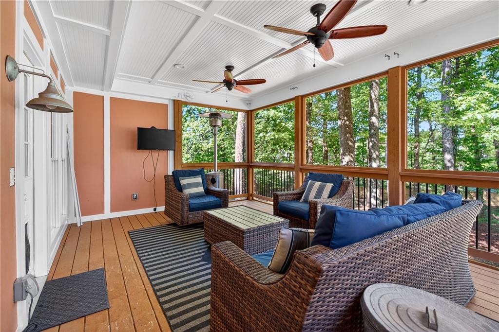 7830 Llangollen Way Cumming, GA 30041 - Photo 24 of 60 a living room with furniture and a large window