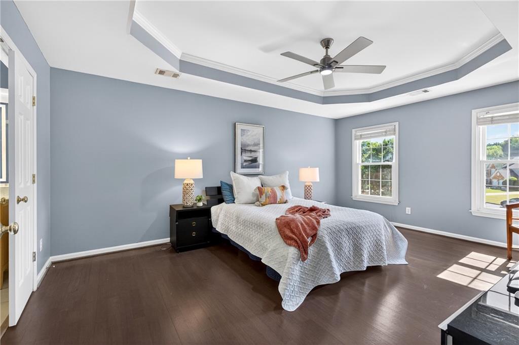 7830 Llangollen Way Cumming, GA 30041 - Photo 28 of 60 a bed room with bed and window