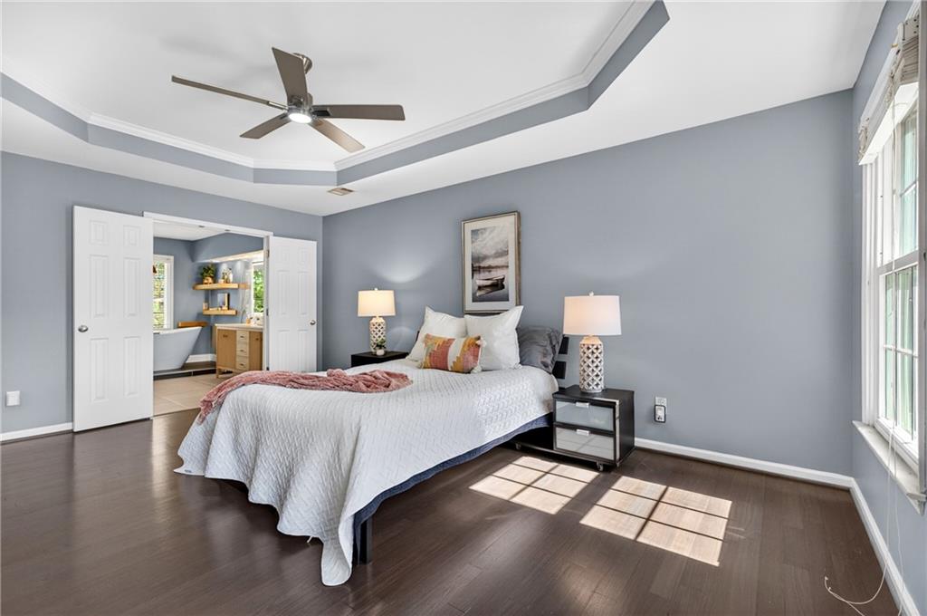 7830 Llangollen Way Cumming, GA 30041 - Photo 29 of 60 a bedroom with a bed and window