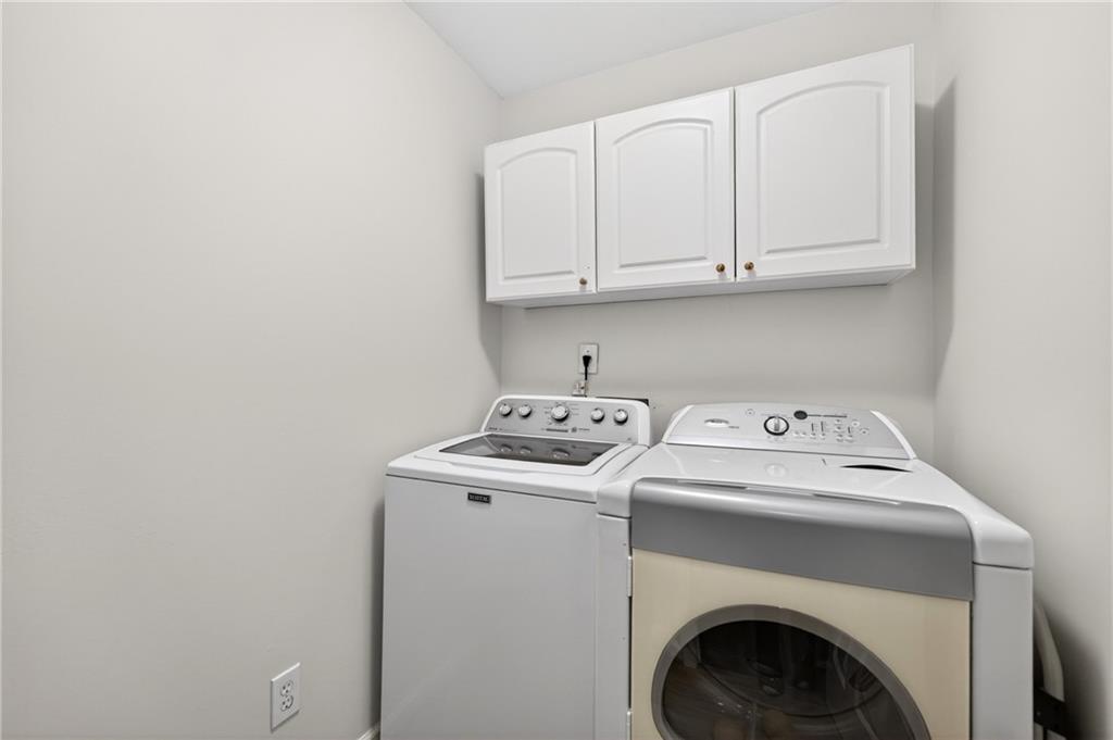 7830 Llangollen Way Cumming, GA 30041 - Photo 42 of 60 a utility room with dryer and washer