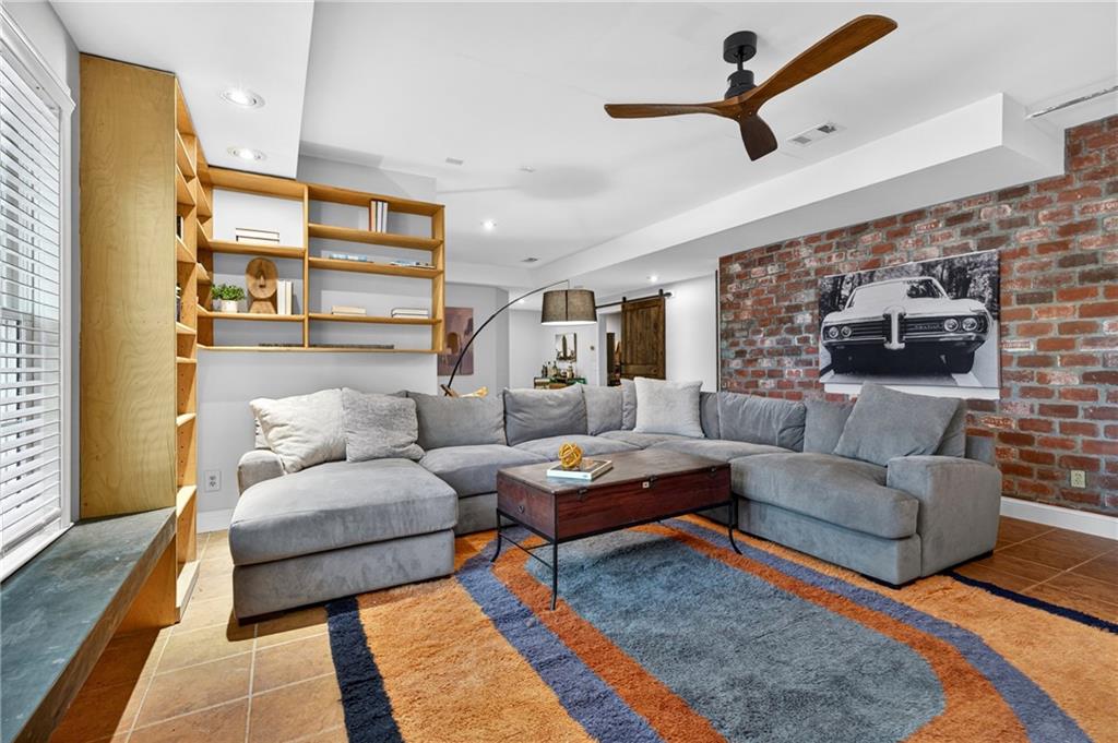 7830 Llangollen Way Cumming, GA 30041 - Photo 46 of 60 a living room with furniture and a rug